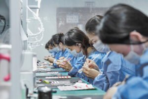 Lavara’s nail artisans working together in the handmade nail workshop.